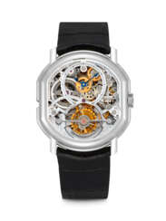 DANIEL ROTH. AN 18K WHITE GOLD “DUAL FACE” SKELETONISED TOURBILLON WITH DATE AND POWER RESERVE