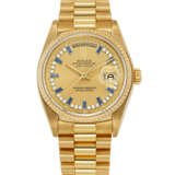 ROLEX. A RARE 18K GOLD, DIAMOND AND SAPPHIRE-SET AUTOMATIC WRISTWATCH WITH SWEEP CENTRE SECONDS, DAY, DATE AND BRACELET - фото 1