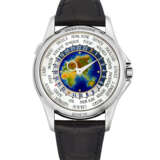 PATEK PHILIPPE. A RARE 18K WHITE GOLD AUTOMATIC WORLD TIME WRISTWATCH WITH CLOISONN&#201; ENAMEL DIAL - photo 1