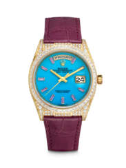 ROLEX. A RARE 18K GOLD, DIAMOND AND PURPLE GEMSTONE-SET AUTOMATIC WRISTWATCH WITH SWEEP CENTRE SECONDS, DAY, DATE AND BLUE HARD STONE DIAL