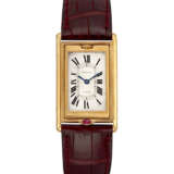 CARTIER. A RARE 18K GOLD LIMITED EDITION RECTANGULAR REVERSIBLE WRISTWATCH, MADE TO COMMEMORATE THE 150TH ANNIVERSARY OF CARTIER - фото 1