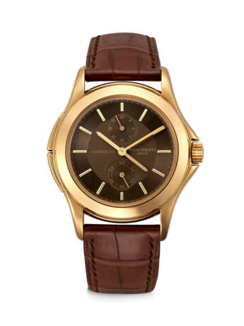 PATEK PHILIPPE. AN EXTREMELY RARE 18K GOLD LIMITED EDITION DUAL TIME WRISTWATCH WITH 24 HOUR INDICATION, MADE FOR THE 150TH ANNIVERSARY OF G&#220;BELIN - photo 1