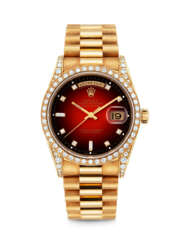 ROLEX. A RARE 18K GOLD AND DIAMOND-SET AUTOMATIC WRISTWATCH WITH SWEEP CENTRE SECONDS, DAY, DATE AND BRACELET