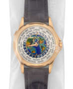 World time. PATEK PHILIPPE. A RARE 18K PINK GOLD AUTOMATIC WORLD TIME WRISTWATCH WITH CLOISONN&#201; ENAMEL DIAL, SINGLE SEALED