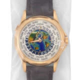 PATEK PHILIPPE. A RARE 18K PINK GOLD AUTOMATIC WORLD TIME WRISTWATCH WITH CLOISONN&#201; ENAMEL DIAL, SINGLE SEALED - photo 1