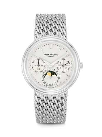 PATEK PHILIPPE. AN 18K WHITE GOLD AUTOMATIC PERPETUAL CALENDAR BRACELET WATCH WITH MOON PHASES, 24 HOUR AND LEAP YEAR INDICATION - photo 1