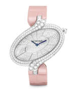 Quarzwerk. CARTIER. A LADY’S ELEGANT 18K WHITE GOLD AND DIAMOND-SET WRISTWATCH