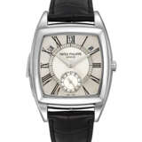 PATEK PHILIPPE. AN EXTREMELY RARE PLATINUM TONNEAU-SHAPED LIMITED EDITION AUTOMATIC “CATHEDRAL” MINUTE REPEATING ANNUAL CALENDAR WRISTWATCH - фото 1