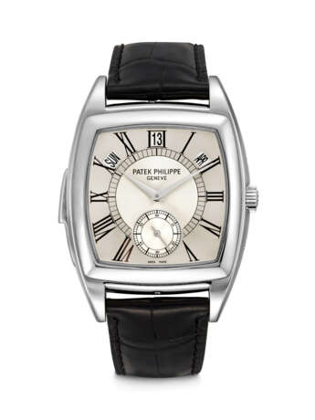 PATEK PHILIPPE. AN EXTREMELY RARE PLATINUM TONNEAU-SHAPED LIMITED EDITION AUTOMATIC “CATHEDRAL” MINUTE REPEATING ANNUAL CALENDAR WRISTWATCH - фото 1