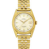 ROLEX. A VERY RARE 18K GOLD AUTOMATIC WRISTWATCH WITH SWEEP CENTRE SECONDS, DATE AND BRACELET - Foto 1