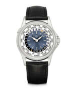 World time. PATEK PHILIPPE. A PLATINUM AUTOMATIC WORLD TIME WRISTWATCH