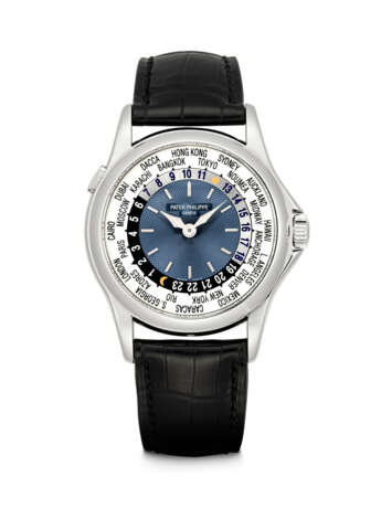 PATEK PHILIPPE. A PLATINUM AUTOMATIC WORLD TIME WRISTWATCH - фото 1