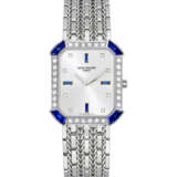 PATEK PHILIPPE. AN 18K WHITE GOLD, DIAMOND AND SAPPHIRE-SET BRACELET WATCH - photo 1