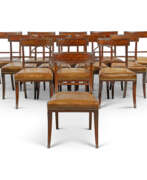 England. A SET OF THIRTEEN REGENCY MAHOGANY DINING-CHAIRS