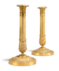 A PAIR OF CHARLES X ORMOLU CANDLESTICKS