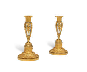 A PAIR OF LOUIS XVI ORMOLU AND SILVERED BRONZE CANDLESTICKS