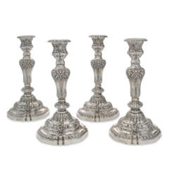 A SET OF FOUR LARGE FRENCH SILVER CANDLESTICKS