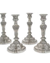A SET OF FOUR LARGE FRENCH SILVER CANDLESTICKS
