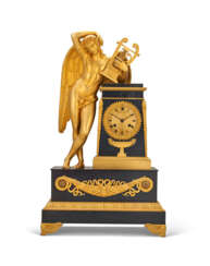 A CHARLES X ORMOLU AND PATINATED BRONZE MANTEL CLOCK