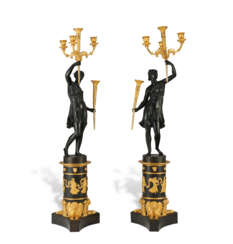 A PAIR OF EMPIRE ORMOLU AND PATINATED BRONZE FIVE-LIGHT CANDELABRA