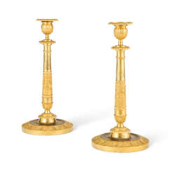 A PAIR OF RESTAURATION ORMOLU CANDLESTICKS