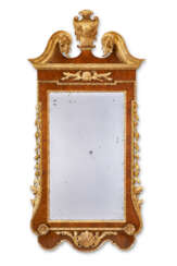 A GEORGE II WALNUT AND PARCEL-GILT MIRROR