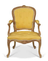 A GEORGE III GILTWOOD ARMCHAIR
