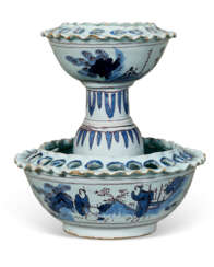 A NORTH EUROPEAN BLUE AND WHITE TIERED TULIP VASE IN PIERCED BOWL