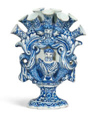 A DUTCH DELFT BLUE AND WHITE FIGURAL TULIP VASE