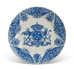 A DUTCH DELFT BLUE AND WHITE ARMORIAL PLATE