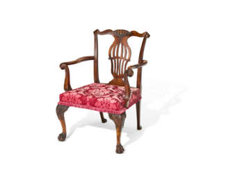 AN IRISH GEORGE II WALNUT ARMCHAIR