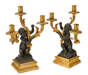 A PAIR OF RESTAURATION ORMOLU AND PATINATED BRONZE THREE-LIGHT CANDELABRA