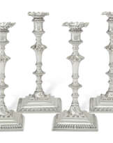 A SUITE OF FOUR GEORGE III SILVER CANDLESTICKS