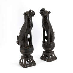 PAIR OF IRON SHISHI GUARDING LIONS ON PEDESTALS