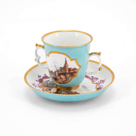 Meissen. PORCELAIN BEAKER WITH DOUBLE HANDLES AND SAUCER WITH TURQUOISE GROUND AND LANDSCAPE CARTOUCHES - photo 1