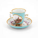 Meissen. PORCELAIN BEAKER WITH DOUBLE HANDLES AND SAUCER WITH TURQUOISE GROUND AND LANDSCAPE CARTOUCHES - photo 1