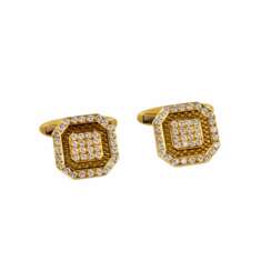 Gold Chopard cufflinks with guilloche and diamonds.