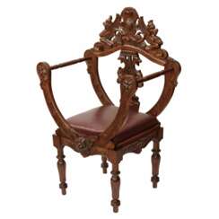 Carved, richly decorated walnut chair. 19th century