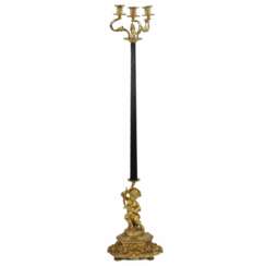 Bronze floor lamp with the figure of Putti. France. 19th century.