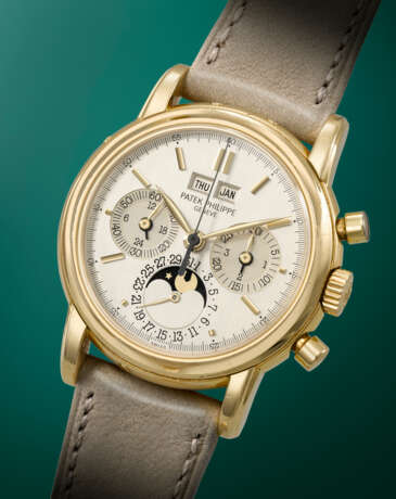 PATEK PHILIPPE. AN EXTREMELY RARE AND HIGHLY ATTRACTIVE 18K GOLD PERPETUAL CALENDAR CHRONOGRAPH WRISTWATCH WITH MOON PHASES, 24 HOUR INDICATION, LEAP YEAR INDICATION AND TWO-TONE DIAL - photo 2