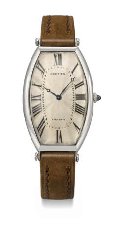 CARTIER. AN EXCEEDINGLY RARE AND EARLY PLATINUM AND 18K GOLD LARGE CURVED TONNEAU-SHAPED WRISTWATCH - photo 1