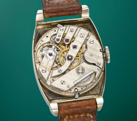 BREGUET. A POSSIBLY UNIQUE, OUTSTANDINGLY RARE, HISTORICALLY IMPORTANT AND PREVIOUSLY UNRECORDED 18K WHITE GOLD TONNEAU-SHAPED PERPETUAL CALENDAR WRISTWATCH WITH RETROGRADE DATE AND MOON PHASES - PROBABLY THE EARLIEST PERPETUAL CALENDAR WRISTWATCH WITH RE - photo 5