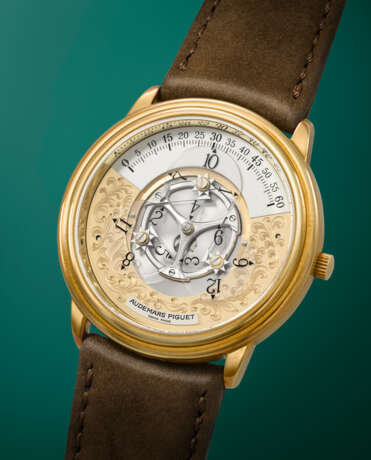 AUDEMARS PIGUET. AN ATTRACTIVE AND UNUSUAL 18K GOLD AUTOMATIC WANDERING HOUR WRISTWATCH - фото 2