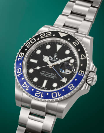 ROLEX. A STAINLESS STEEL DUAL TIME WRISTWATCH WITH SWEEP CENTRE SECONDS, DATE AND BRACELET - фото 2