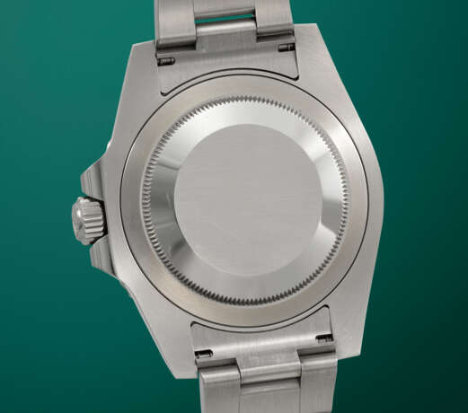 ROLEX. A STAINLESS STEEL DUAL TIME WRISTWATCH WITH SWEEP CENTRE SECONDS, DATE AND BRACELET - photo 4