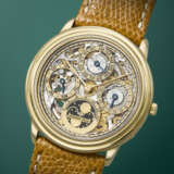 AUDEMARS PIGUET. A RARE AND ELEGANT 18K GOLD AUTOMATIC SKELETONIZED PERPETUAL CALENDAR WRISTWATCH WITH MOON PHASES - фото 2