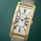 CARTIER. AN EXTREMELY RARE, ELEGANT AND LARGE RECTANGULAR CURVED 18K GOLD WRISTWATCH - photo 2