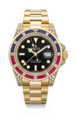 ROLEX. A RARE AND DAZZLING 18K GOLD, DIAMOND, RUBY AND SAPPHIRE-SET AUTOMATIC DUAL TIME WRISTWATCH WITH SWEEP CENTRE SECONDS, DATE AND BRACELET