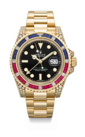 ROLEX. A RARE AND DAZZLING 18K GOLD, DIAMOND, RUBY AND SAPPHIRE-SET AUTOMATIC DUAL TIME WRISTWATCH WITH SWEEP CENTRE SECONDS, DATE AND BRACELET - photo 1