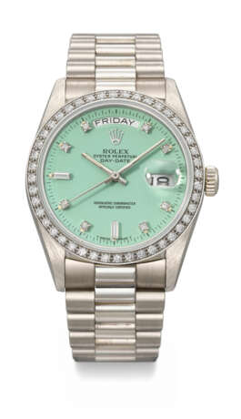 ROLEX. AN EXTREMELY RARE AND VIBRANT 18K WHITE GOLD AND DIAMOND-SET AUTOMATIC WRISTWATCH WITH SWEEP CENTRE SECONDS, DAY, DATE, BABY GREEN LACQUERED `STELLA` DIAL AND BRACELET - photo 1